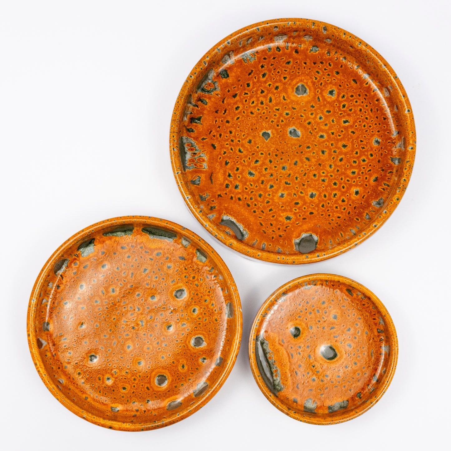 Stan ceramic bowls set of three, nesting bowls, amber and green reactive lava glaze, speckled finish