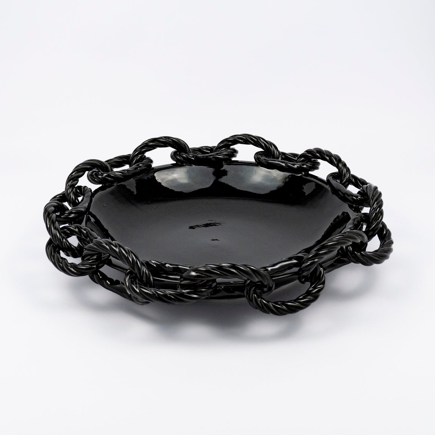 Rassilo ceramic round platter, glossy black glaze, openwork twisted rope chain-link rim