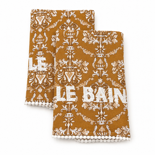 Alma Le Bain golden ochre damask block-print guest towels, white LE BAIN embroidery, pom-pom trim, terry lined, set of two