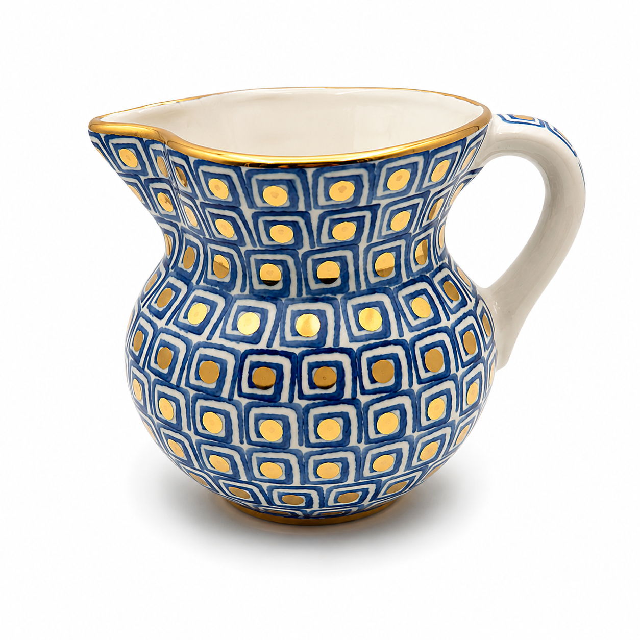 Front view of Azzurra Maiolica ceramic pitcher showing navy blue geometric pattern and gold dot accents