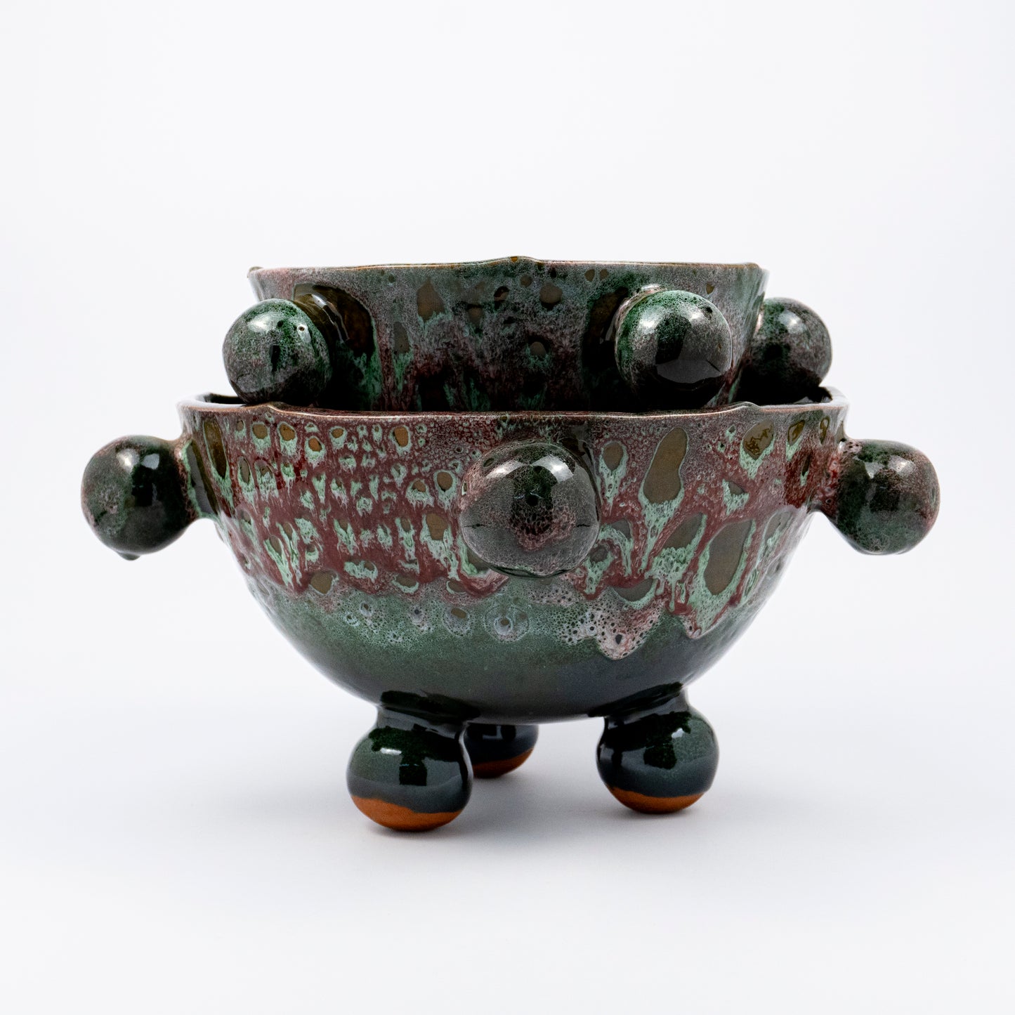 Ballo medium and large ceramic bowl, purple and green reactive glaze, sculptural bobble details, ball feet, wavy rim