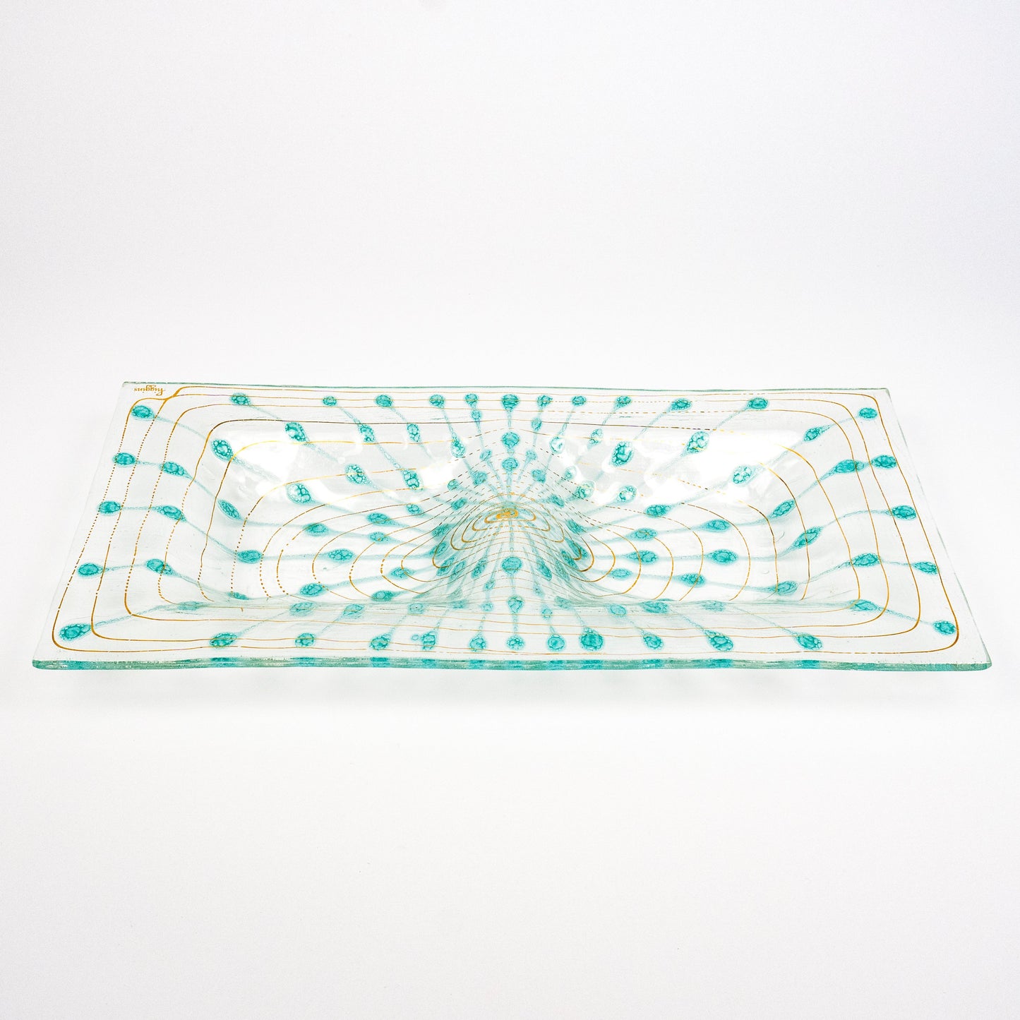 A rectangular clear glass platter with a hand-blown turquoise and gold pattern, photographed on a seamless white background.