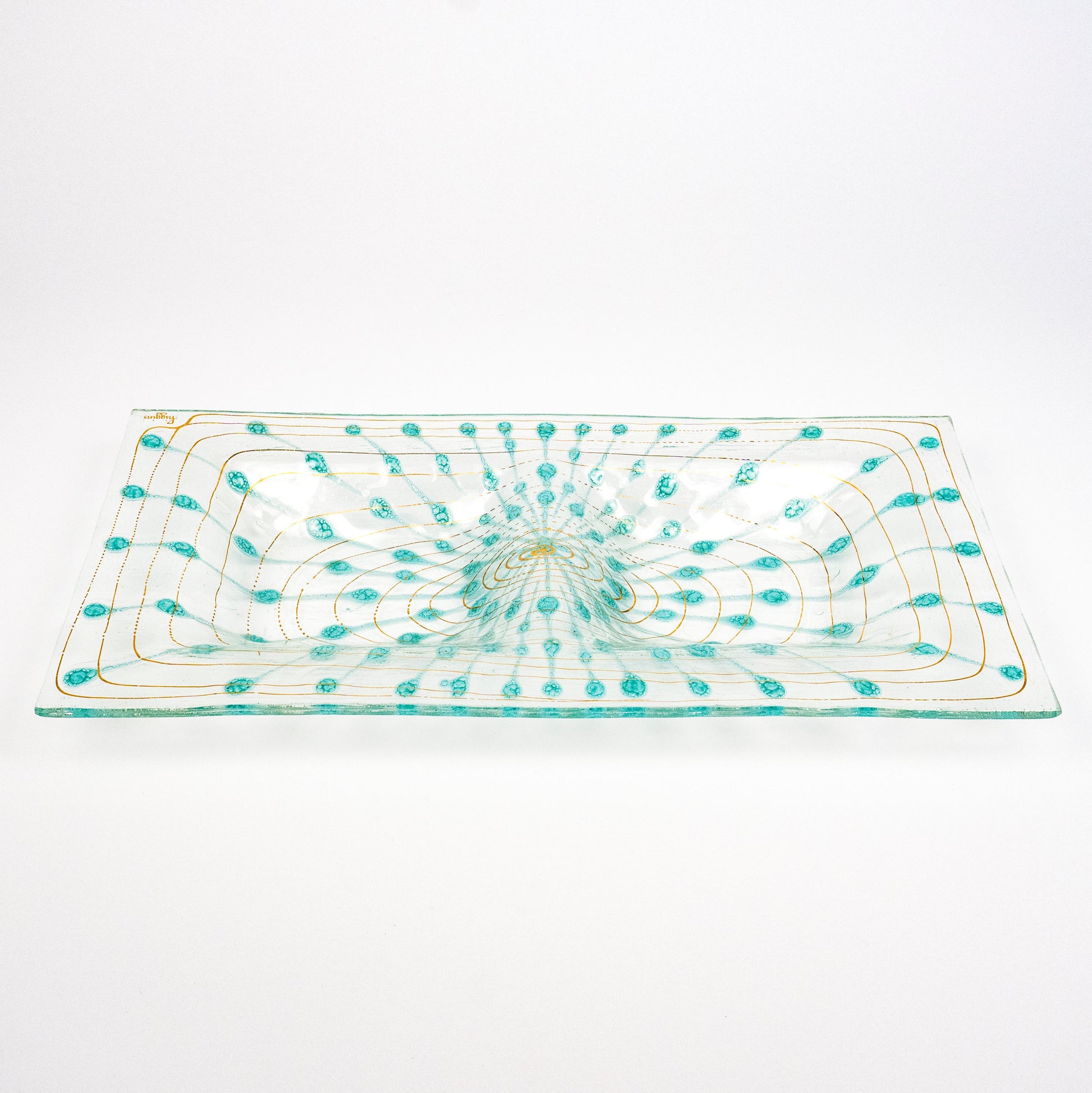 A rectangular clear glass platter with a hand-blown turquoise and gold pattern, photographed on a seamless white background.