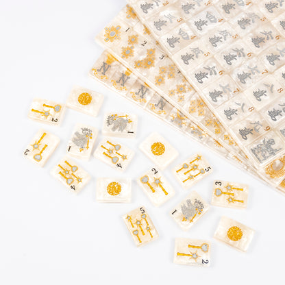 Club Mah Jenn D'or mahjong set, silver and gold metallic on white pearl acrylic tiles, clear acrylic box, mother-of-pearl racks