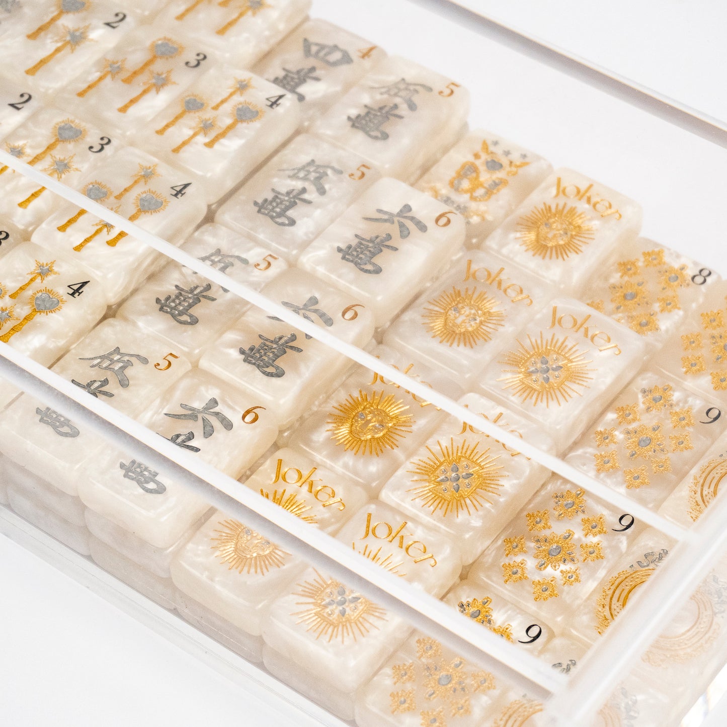 Club Mah Jenn D'or mahjong set, silver and gold metallic on white pearl acrylic tiles, clear acrylic box, mother-of-pearl racks