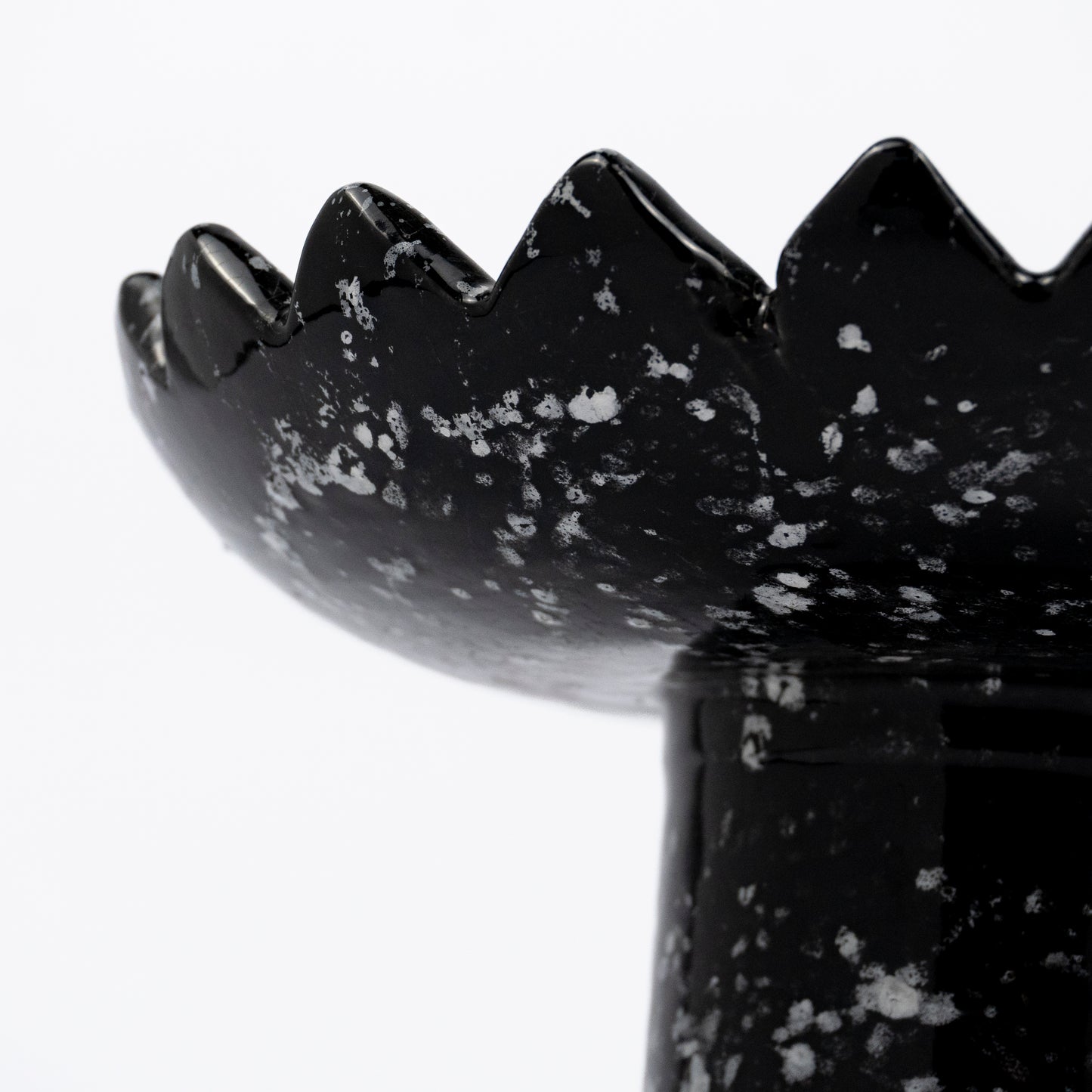 Floree ceramic pedestal bowl, black with white speckle glaze, sawtooth zigzag rim, footed base