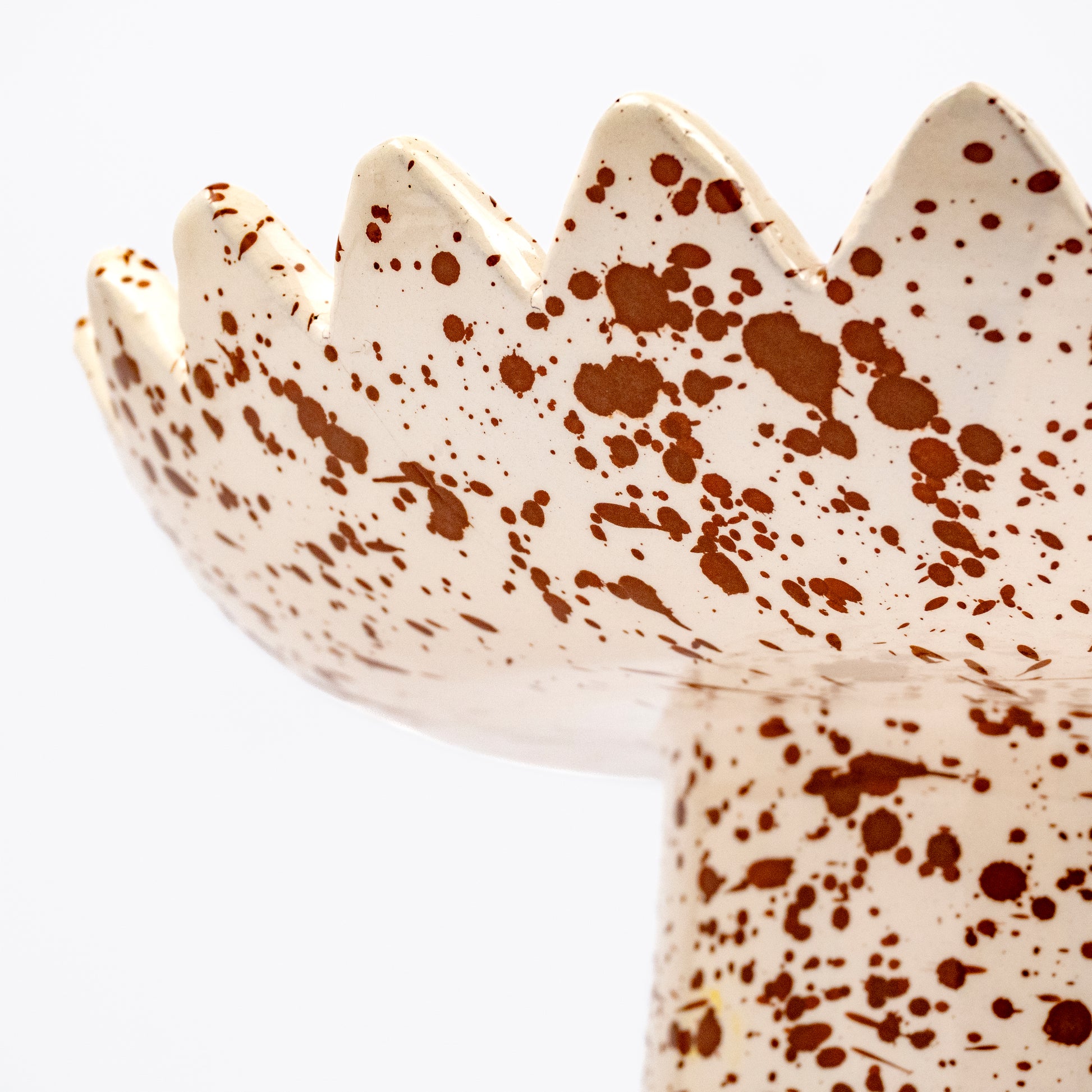 Floree ceramic pedestal bowl, cream with rich brown speckle glaze, sawtooth zigzag rim, footed base