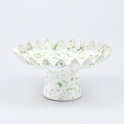 Floree ceramic pedestal bowl, white with light green speckle glaze, sawtooth zigzag rim, footed base