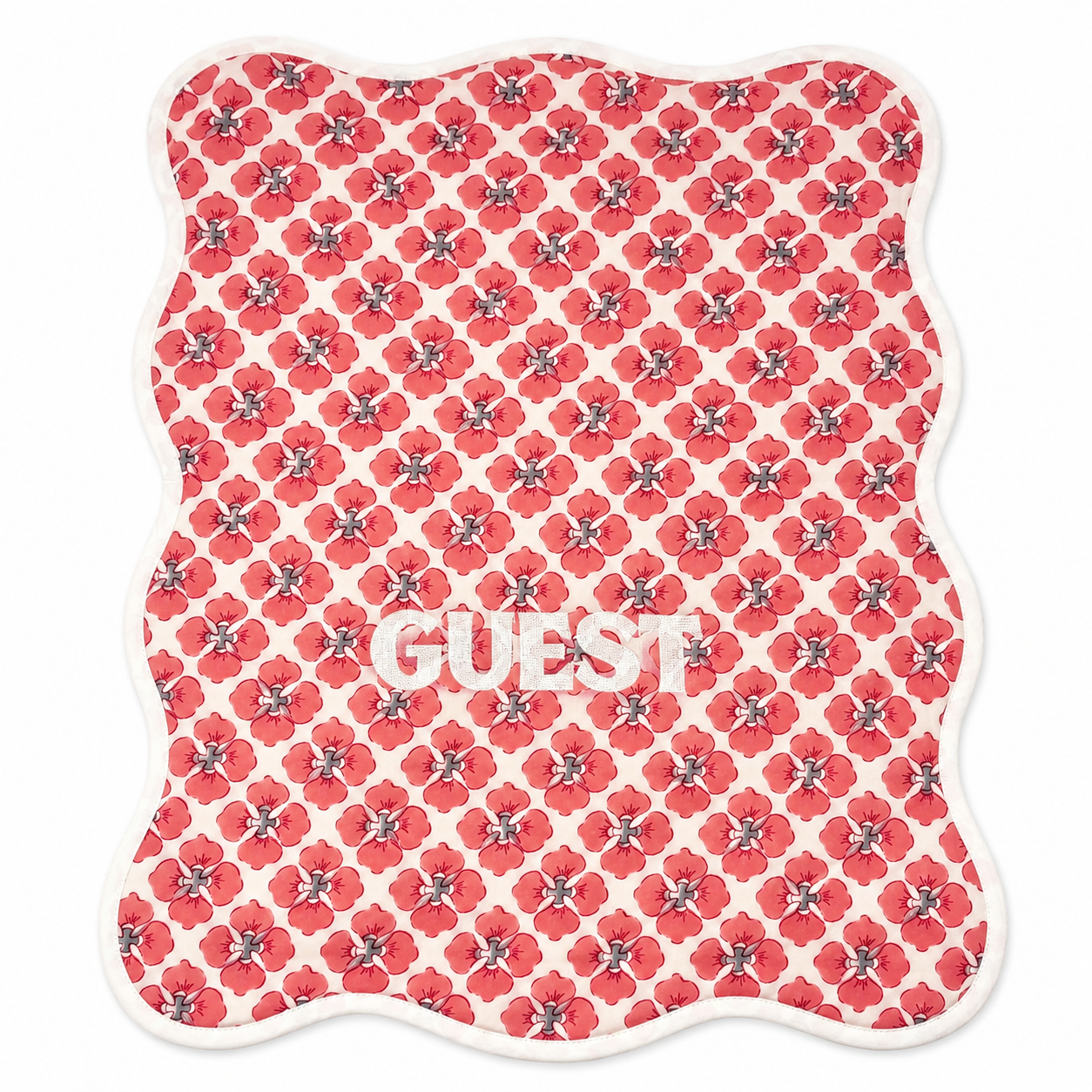 Close up of Geo Guest red poppy block-print hand towels, white GUEST embroidery, terry lined, set of two