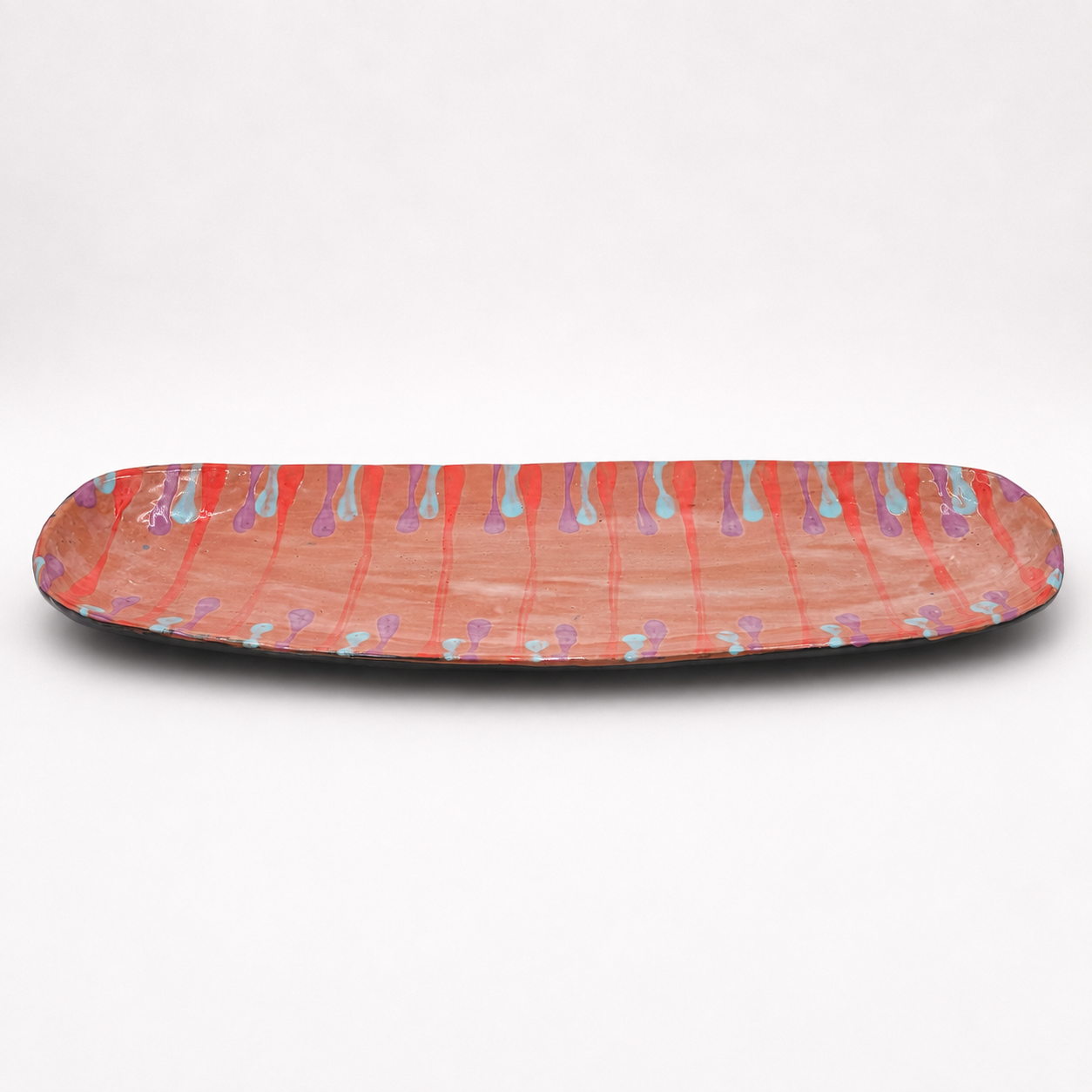 Side view of Lonza oven-safe ceramic serving platter showing long narrow shape and dark exterior glaze