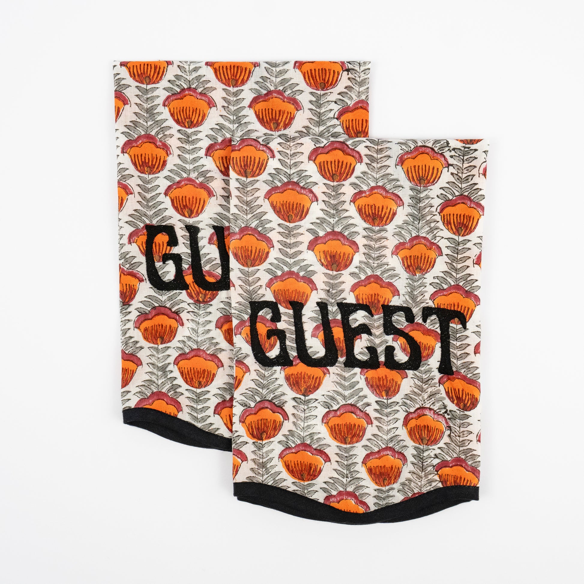 Magnolia cream floral block-print guest towels, orange poppies, black GUEST embroidery, set of two