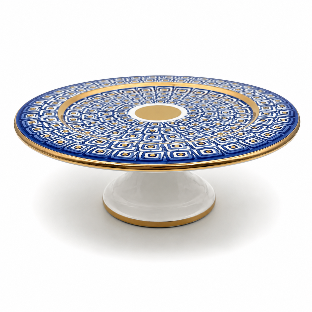 Nico Maiolica ceramic cake stand on pedestal base, navy blue geometric pattern with gold rim and center medallion