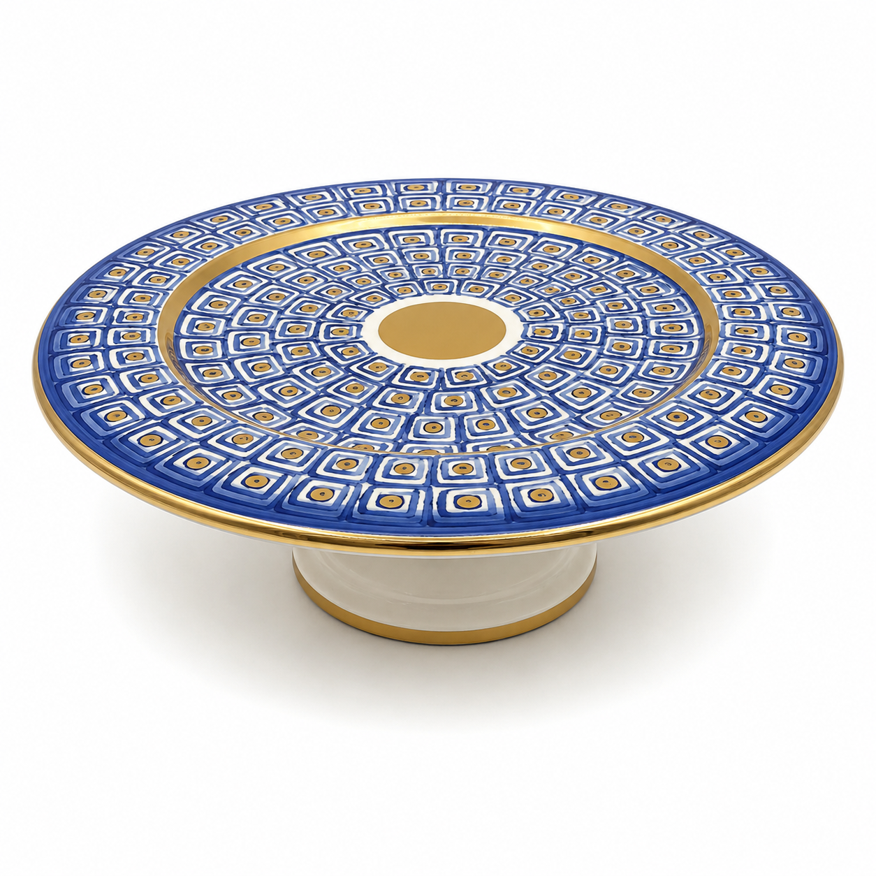 Top view of Nico Maiolica ceramic cake stand showing navy blue geometric pattern and gold center medallion
