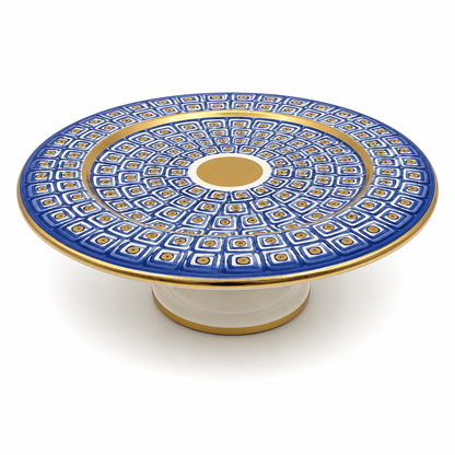 Top view of Nico Maiolica ceramic cake stand showing navy blue geometric pattern and gold center medallion