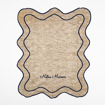 Nino Notre Maison natural linen guest towels, navy script embroidery, scalloped navy wave trim, set of two