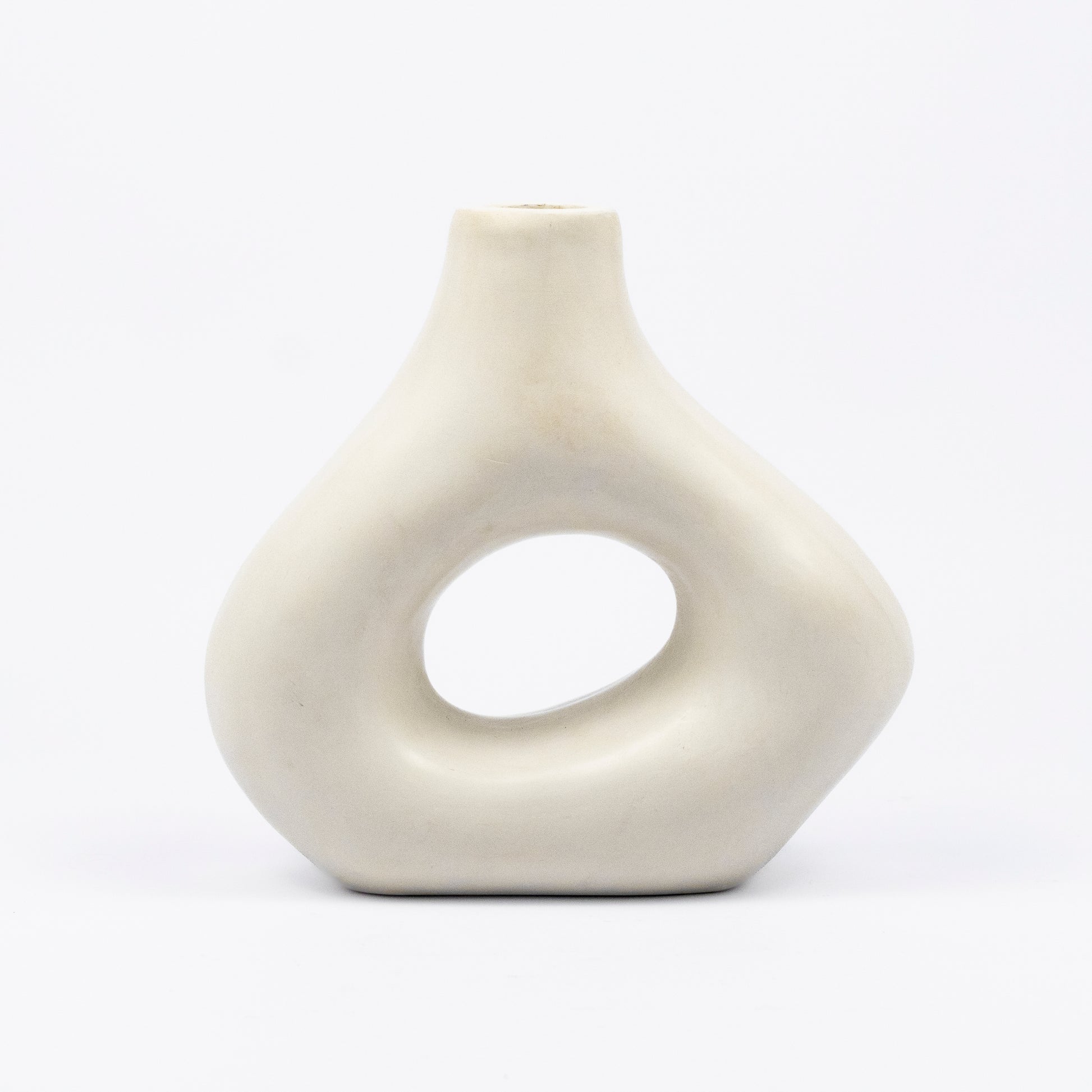 Cream ceramic vase, organic asymmetric form with open cutout center, matte finish, narrow spout