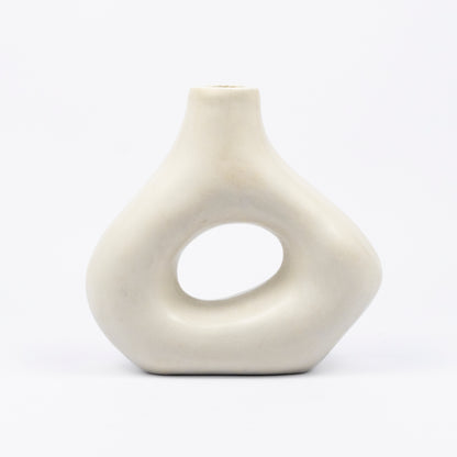 Cream ceramic vase, organic asymmetric form with open cutout center, matte finish, narrow spout