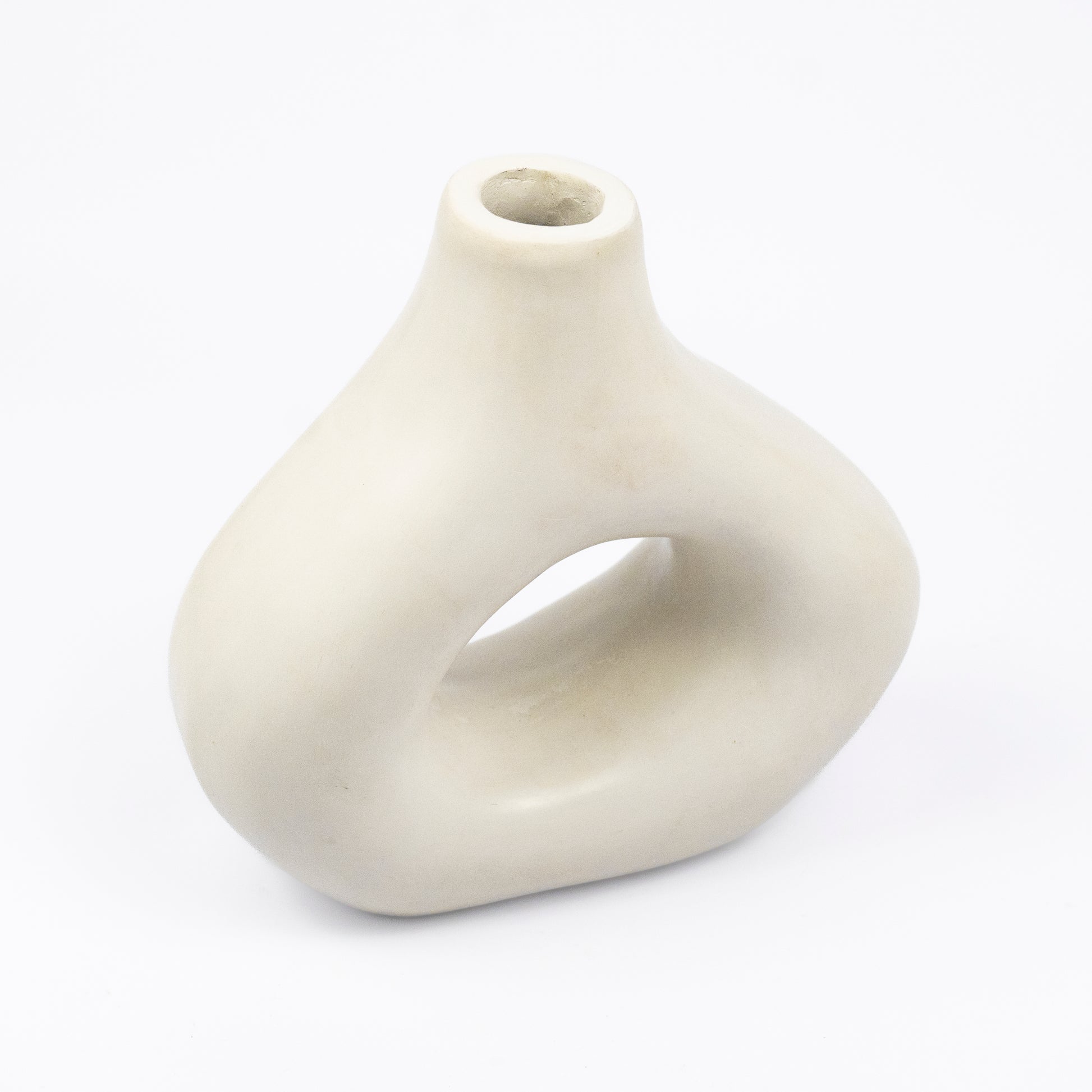 Cream ceramic vase, organic asymmetric form with open cutout center, matte finish, narrow spout