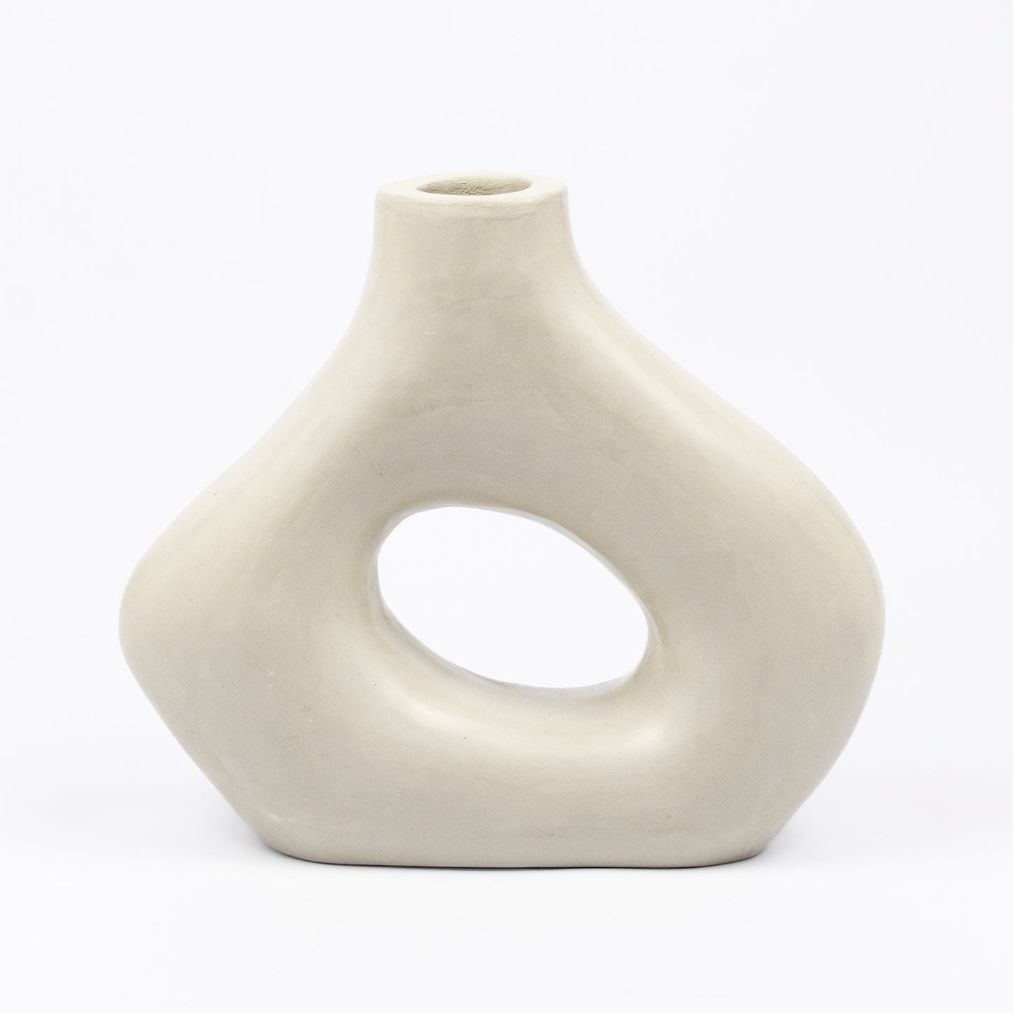 Cream ceramic vase, organic asymmetric form with open cutout center, matte finish, narrow spout