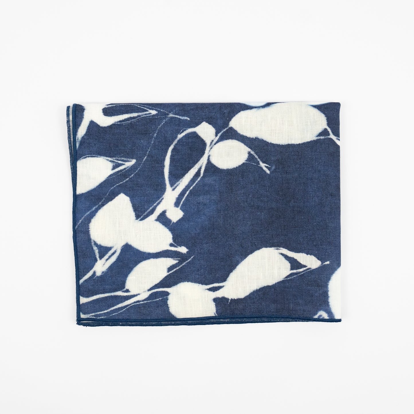 Porto indigo linen dinner napkins, navy and white botanical sunprint pattern, set of four
