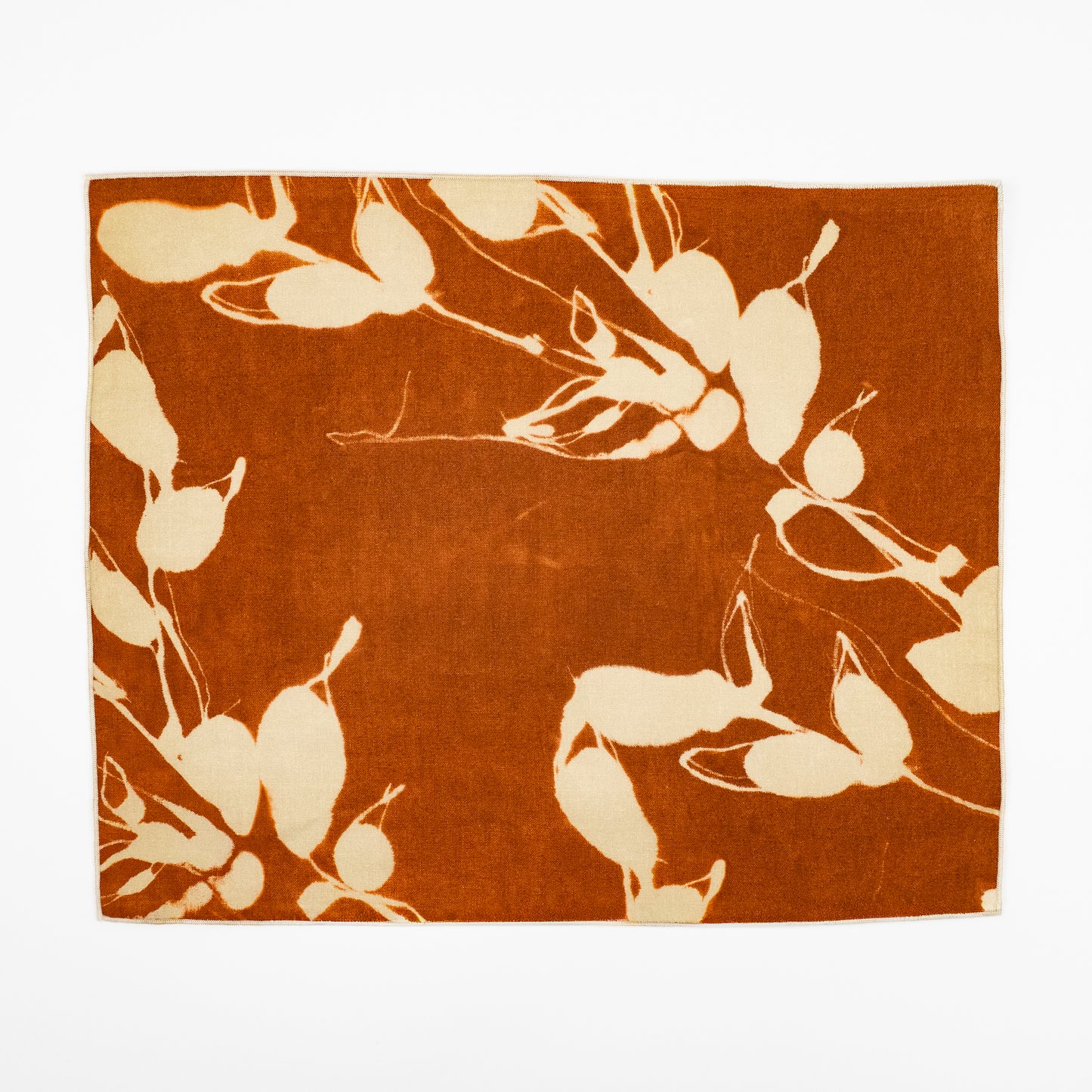 Porto indigo linen botanical sunprint placemat, navy and white leaf pattern