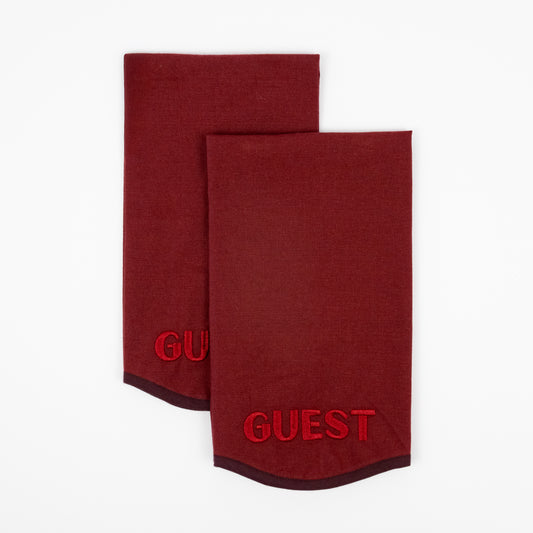 Rene burgundy hand towels, tonal red GUEST embroidery, burgundy trim, set of two