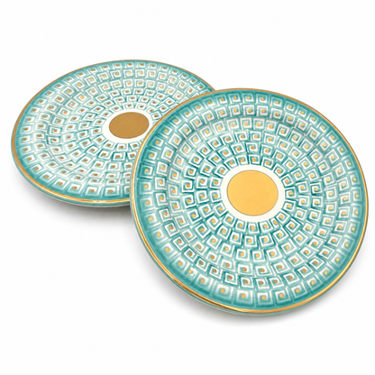 Set of two Serena Maiolica ceramic serving platters with teal geometric pattern and gold center medallion