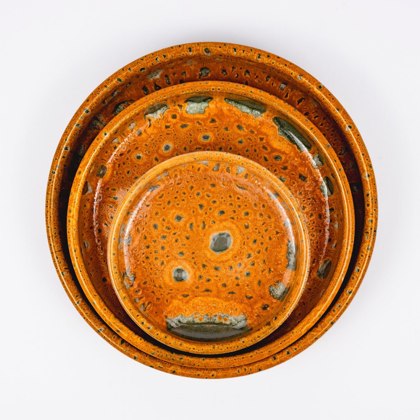Stan ceramic bowls set of three, nesting bowls, amber and green reactive lava glaze, speckled finish