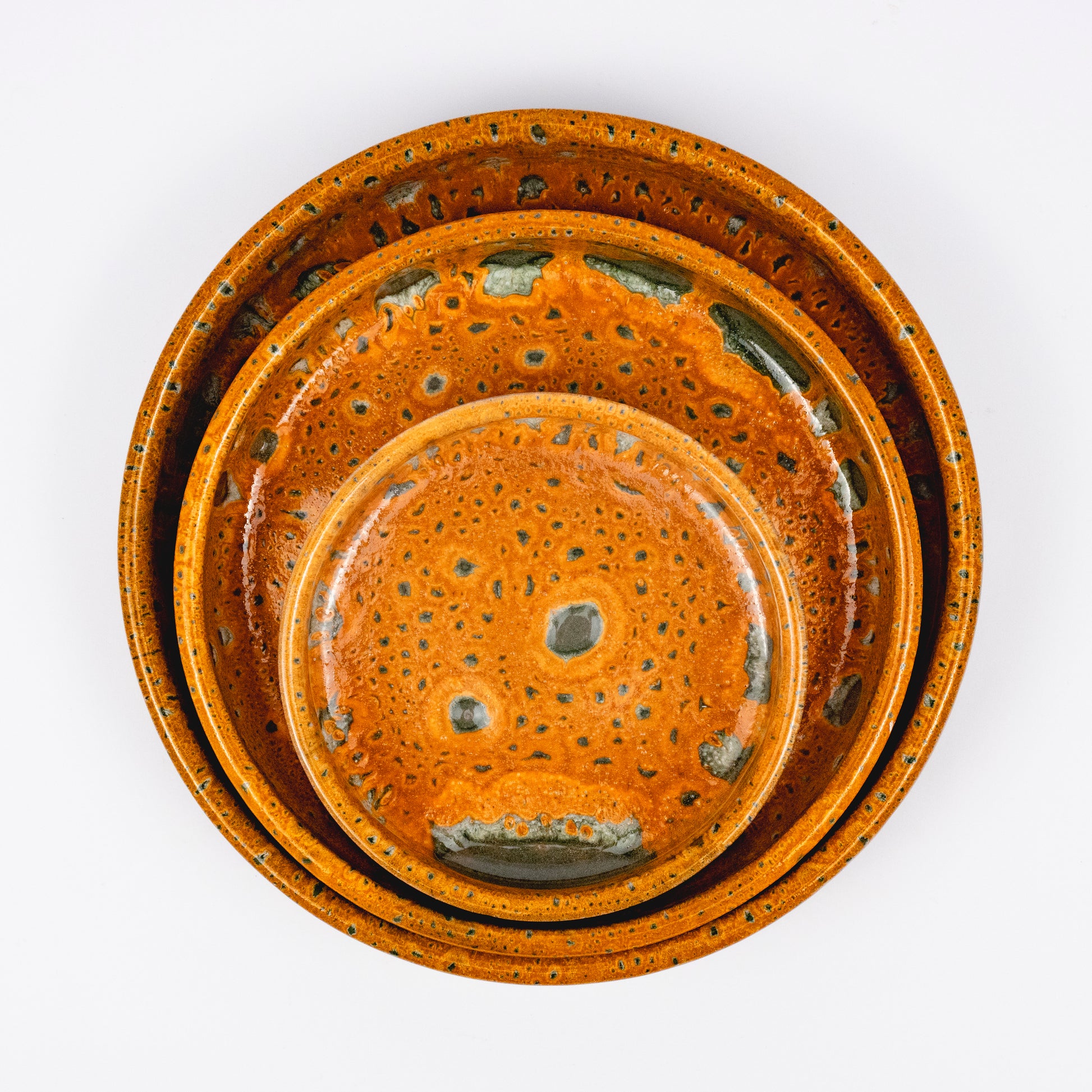 Stan ceramic bowls set of three, nesting bowls, amber and green reactive lava glaze, speckled finish
