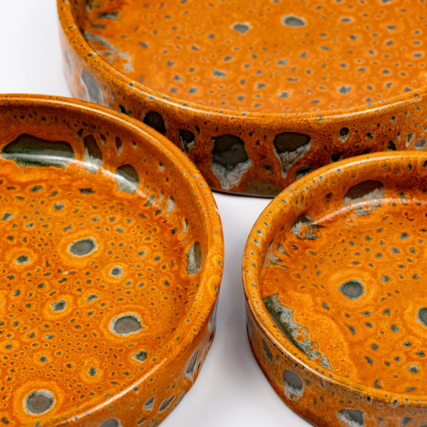 Stan ceramic bowls set of three, nesting bowls, amber and green reactive lava glaze, speckled finish
