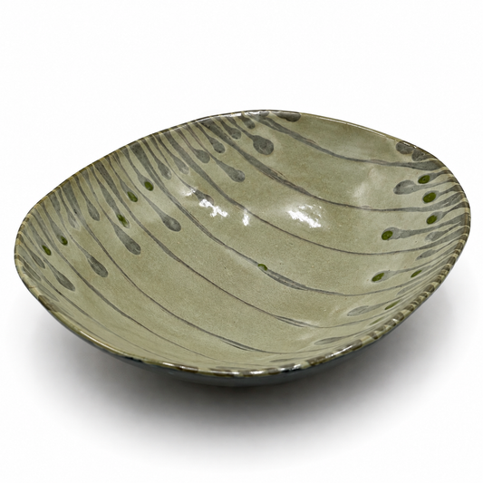 Varde oven-safe ceramic serving bowl with organic gray drip glaze pattern and green accent dots